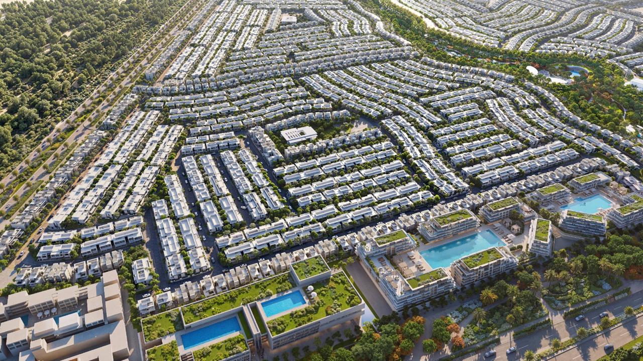 Azizi Florence Sharjah — the apartment cluster and its pool decks from the air