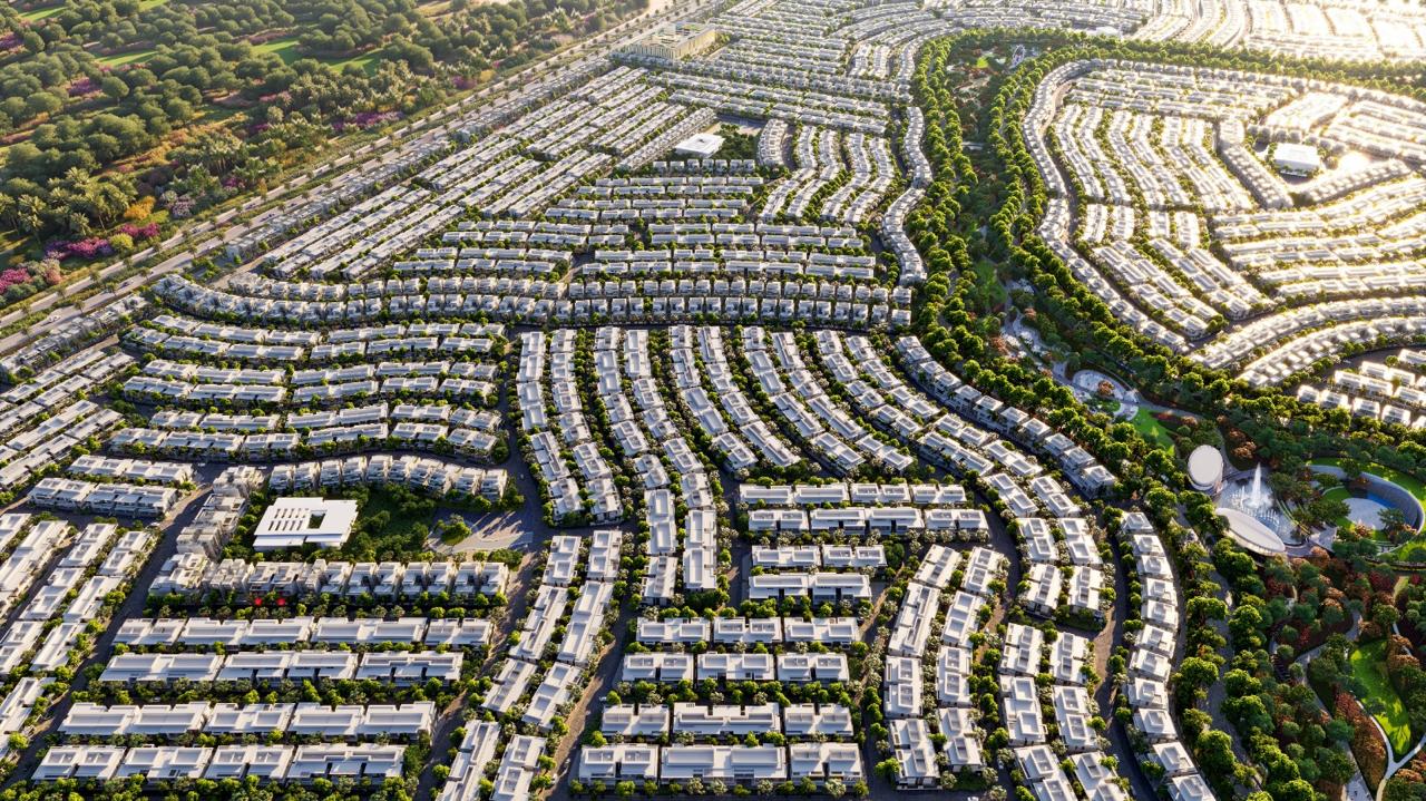 Azizi Florence Sharjah — curved townhouse clusters at golden hour
