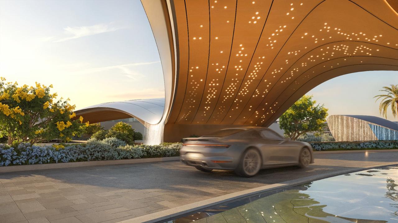 Azizi Florence Sharjah — the illuminated gateway canopy and arrival drive