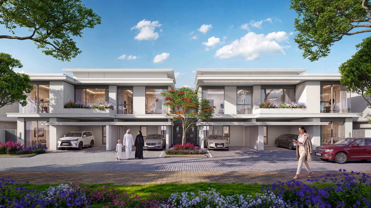 Azizi Florence Sharjah — a townhouse frontage with residents on the street