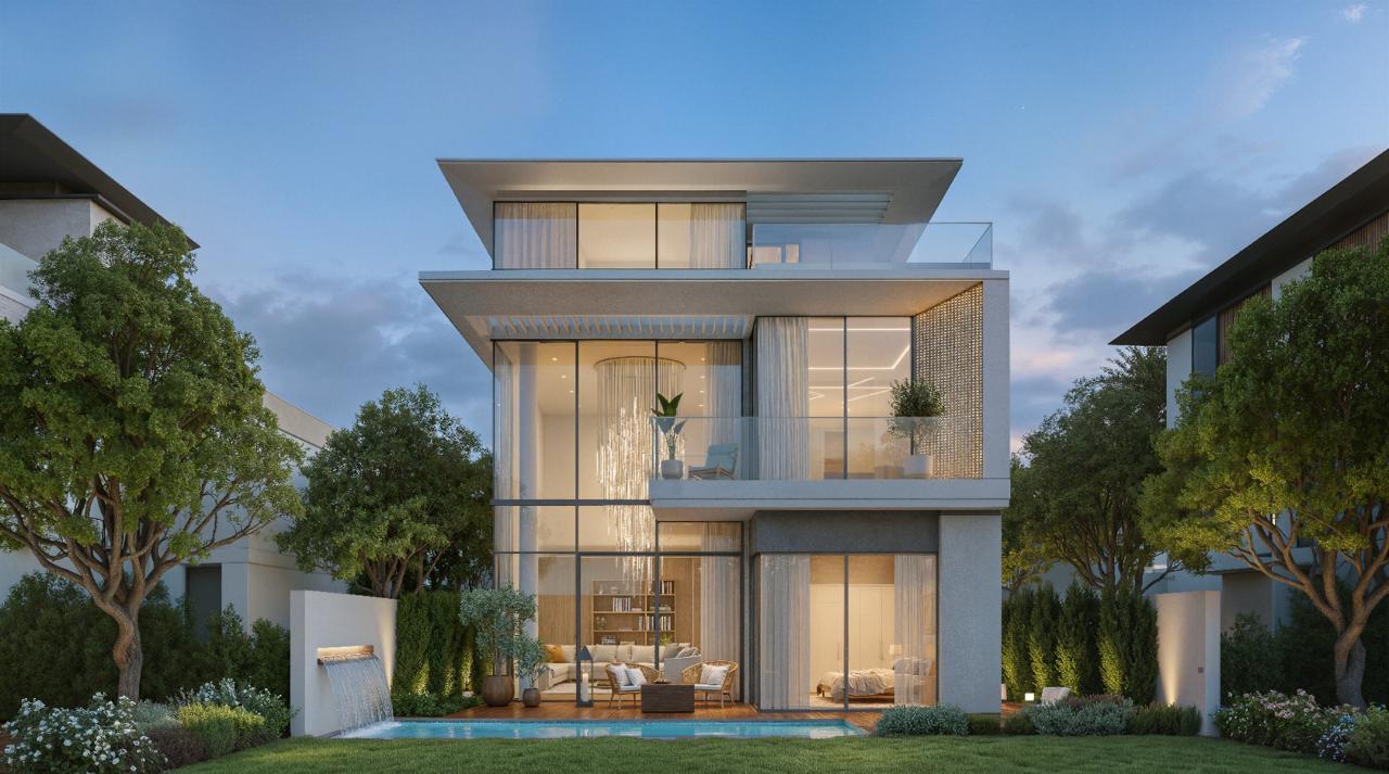 Azizi Florence Sharjah — a villa pool terrace and water feature at dusk