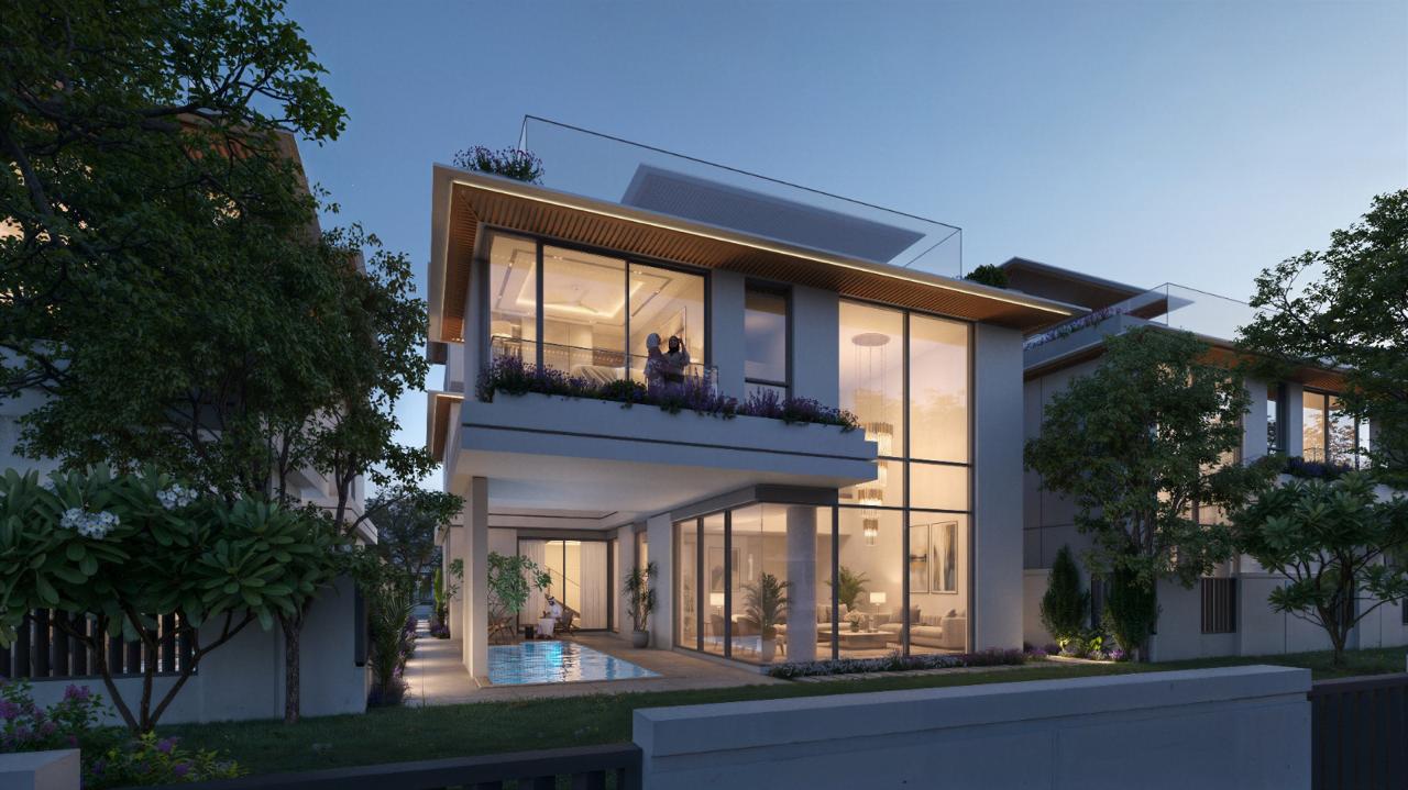 Azizi Florence Sharjah — a villa terrace and pool in the evening