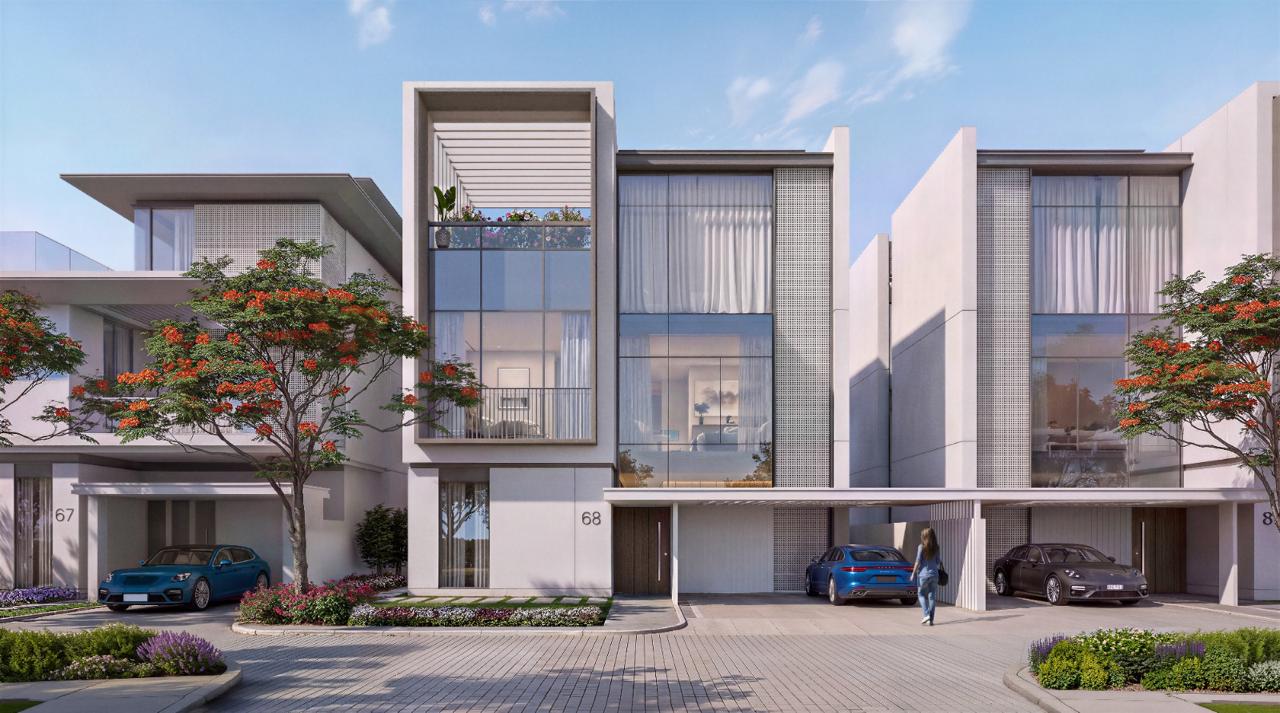 Azizi Florence Sharjah — a villa street elevation with flame trees